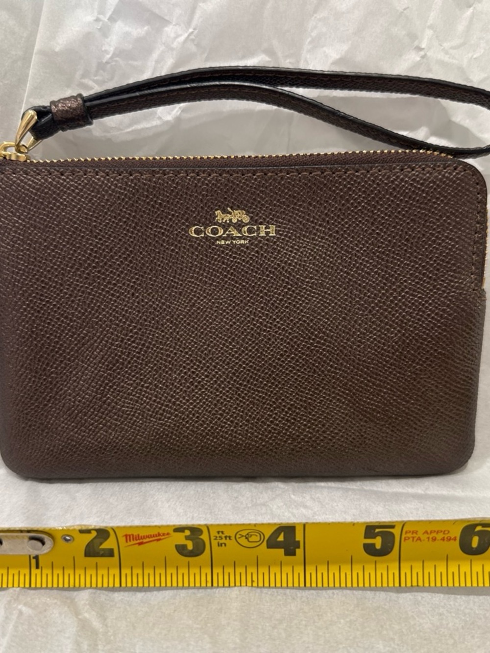 COACH Dark Brown Leather Wristlet with Gold Logo